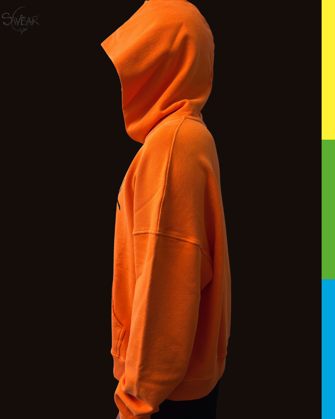 A bright orange pullover hoodie shown in side profile against a black background, with a vertical multicolor accent strip on the far right edge.