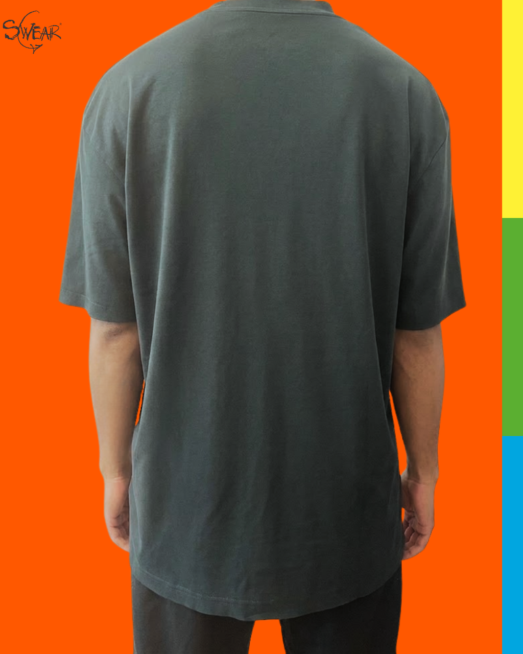 A person shown from the back wearing an oversized dark charcoal gray t-shirt, set against a bright orange background with a vertical multicolor stripe on the right side.